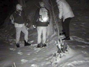 This undated surveillance photo provided by U.S. Customs and Border Protection shows people illegally crossing the United States border from Canada near Derby Line, Vt. Though attention is focused on illegal immigration into the United States from Mexico, officials and documents say there has been a quiet increase in the number of people apprehended entering illegally on the northern border between Quebec and Vermont. (U.S. Customs and Border Protection via AP)