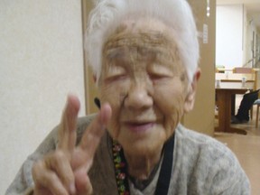 In this Jan. 2, 2018, photo provided by Goodtime Home 1, Kane Tanaka flashes a peace sign during her 115th birthday celebration at her nursing home in Fukuoka, southwestern Japan. Tanaka became the new oldest person in Japan after 117-year-old Japanese woman Chiyo Miyako, the world's oldest person, died on Sunday, July 27, 2018.