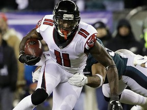 In this Jan. 13, 2018, file photo, Atlanta Falcons wide receiver Julio Jones (11) runs against the Philadelphia Eagles in Philadelphia. 
The person, speaking on condition of anomity because the contract talks have not been made public, said Thursday, July 19, 2018, that the Falcons informed Jones a few weeks ago that they didn't have room under the salary cap to offer him a new deal. (AP Photo/Matt Rourke, File)