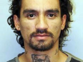 This undated file photo provided by the Hawaii Police Department shows Justin Joshua Waiki.