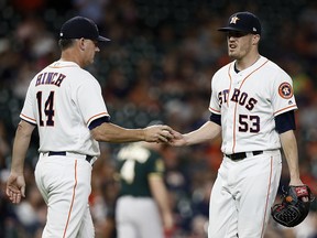 Manager A.J. Hinch of the Houston Astros takes the ball from Ken Giles in the ninth inning against the Oakland Athletics at Minute Maid Park on July 10, 2018 in Houston. (Bob Levey/Getty Images)
