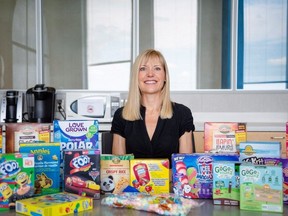 Charlene Elliott, of the University of Calgary, poses with an array of gluten-free packaged foods marketed for children in an undated handout photo.