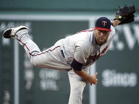 Minnesota Twins starting pitcher Lance Lynn delivers to a Boston Red Sox batter at Fenway Park, Friday, July 27, 2018, in Boston. (AP Photo/Elise Amendola)