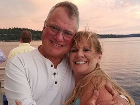 Larry and Lori Isenberg in happier times. He was murdered and cops believe Lori -- now on the run -- and her daughters had something to do with it.