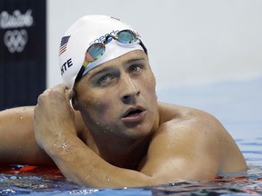United States' Ryan Lochte checks his time in a men's 4x200-meter freestyle heat at the 2016 Summer Olympics, in Rio de Janeiro, Brazil on Aug. 9, 2016. (AP Photo/Michael Sohn)