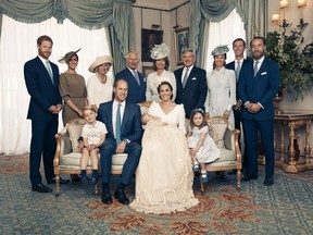 This Monday, July 9, 2018, photo provided by the Duke and Duchess of Cambridge shows the official photograph to mark the christening of Prince Louis at Clarence House, following Prince Louis' baptism, in London. Seated, left to right: Prince George, Prince William, the Duke of Cambridge; Prince Louis; Kate, the Duchess of Cambridge; and Princess Charlotte. Standing, left to right: Prince Harry, The Duke of Sussex; Megan, the Duchess of Sussex; Camilla, the Duchess of Cornwall; Prince Charles, Prince of Wales; Carole Middleton, Michael Middleton, Pippa Matthews, James Matthews and James Middleton. (AP Photo/Matt Holyoak)