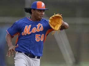 In this Feb. 21, 2015, file photo, New York Mets pitcher Jenrry Mejia catches a ball during spring training practice in Port St. Lucie, Fla. (AP Photo/Jeff Roberson, File)