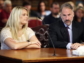 In this July 11, 2018 photo, Tara Lambert (also known as Tara Arbogast), left, appeared in Pickaway County Common Pleas Court to plea on a charge of conspiracy to commit aggravated murder in Circleville, Ohio. (Doral Chenoweth III/The Columbus Dispatch via AP)