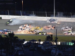 Kyle Larson (42), Alex Bowman (88), Kurt Busch (41), Denny Hamlin (11), Chase Elliott (9), Clint Bowyer (14), Joey Logano (22), Jimmie Johnson (48), Brad Keselowski (2) and Daniel Suarez (19), get caught in a multi-car accident in Turn 3 as Austin Dillon (3) and Kasey Kahne (95) try to avoid them during the NASCAR Cup Series auto race at Daytona International Speedway, Saturday, July 7, 2018, in Daytona Beach, Fla.