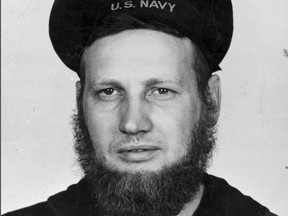 In this June 20, 1942 photo provided by the Naval History and Heritage Command, Howard Curtis, a U.S. Navy second-class aerographer, wears a seven-month's beard at Dutch Harbor, Alaska. (Naval History and Heritage Command via AP)