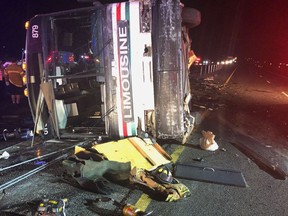 A bus remains on the scene of a multi-vehicle deadly crash Sunday, July 15, 2018, on Interstate 25 just north of Bernalillo, N.M. (Rio Rancho Fire Rescue via AP)