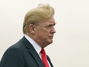 President Donald Trump boards Air Force One at Morristown Municipal Airport, in Morristown, N.J., Sunday, July 22, 2018, en route to Washington after staying at Trump National Golf Club in Bedminster, N.J.