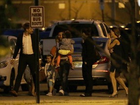 Pablo Villavicencio, center, carries one of his daughters while walking with his other daughter moments after he was released from the Hudson County Correctional Facility, Tuesday, July 24, 2018, in Kearny, N.J. (AP Photo/Julio Cortez)