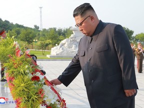 North Korean leader Kim Jong Un visits the tombs, on the 65th anniversary of the signing of the ceasefire armistice that ends the fighting in the Korean War, in Pyongyang on July 26, 2018. (Agency/Korea News Service via AP)