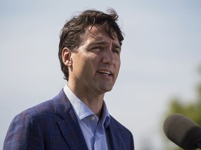 Prime Minister Justin Trudeau makes an announcement of $90 million to improve the Trans-Canada Highway in northeastern Nova Scotia during a press conference in Sutherlands River, N.S. on Tuesday, July 17, 2018. (The Canadian Press/Darren Calabrese)