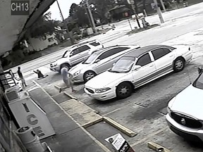 In this July 19, 2018 file frame from surveillance video released by the Pinellas County Sheriff's Office, Markeis McGlockton, far left, is shot by Michael Drejka during an altercation in the parking lot of a convenience store in Clearwater, Fla. (Pinellas County Sheriff's Office via AP, File)