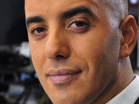 In this photo dated Nov. 22, 2010, notorious French criminal Redoine Faid poses prior to an interview with French all-news TV channel, LCI, as he was promoting his book, in Boulogne-Billancourt, outside Paris, France.