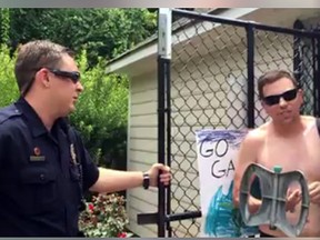 A police officer speaks to a man who questioned Jasmine Abhulimen's use of her community's pool. (Facebook screen grab)