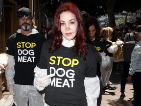 Actress Priscilla Presley attends a protest in Los Angeles against the South Korea dog meat trade on Tuesday, July 17, 2018.