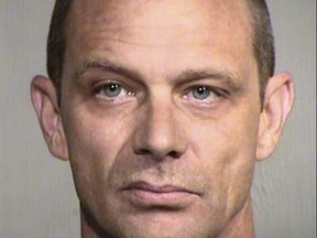 This undated photo provided by the Maricopa County Sheriff's office shows Matthew Disbro. Arizona authorities say the 44-year-old uniformed security guard is accused of impersonating a police officer by trying to pull over an unmarked car that happened to contain two state troopers patrolling a Phoenix freeway. (Maricopa County Sheriff's Office via AP)