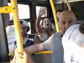 In a viral video, a woman launches an anti-Muslim tirade aboard a New York City bus. (YouTube/Nightblade)