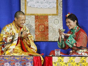 Sakyong Mipham Rinpoche, left, and his bride Princess Tseyang Palmo smile during their Tibetan Buddhist royal wedding ceremony in Halifax on June 10, 2006. (THE CANADIAN PRESS/Andrew Vaughan)