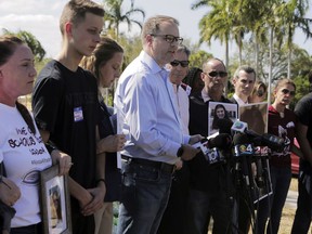 Ryan Petty, center, father of slain student Alaina Petty, at a news conference on March 5, 2018, surrounded by other parents of the victims of the fatal Valentine's Day shooting at Marjory Stoneman Douglas High School in Parkland, Fla. (AP Photo/Jose A. Iglesias)