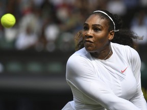 Serena Williams returns a ball to Julia Goerges during their women's semifinal match at the Wimbledon Tennis Championships in London, Thursday, July 12, 2018.