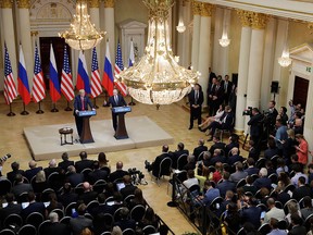 U.S. President Donald Trump, left, and Russian President Vladimir Putin hold a press conference after their meeting at the Presidential Palace in Helsinki, Finland, Monday, July 16, 2018.