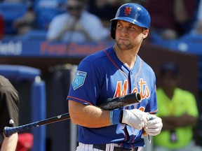 In this March 2, 2018, file photo, New York Mets' Tim Tebow walks back to the dugout after striking out during a spring training game against the Washington Nationals, in Port St. Lucie, Fla. (AP Photo/Jeff Roberson, File)