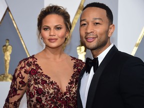 Singer John Legend and Chrissy Teigen arrives on the red carpet for the 88th Oscars on February 28, 2016 in Hollywood. (Getty Images)