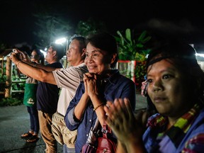 Onlookers watch and cheer as ambulances deliver boys rescued from a cave in northern Thailand to hospital in Chiang Rai after they were transported by helicopters on July 8, 2018 in Chiangrai, Thailand. (Lauren DeCicca/Getty Images)