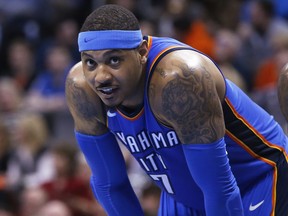 Oklahoma City Thunder forward Carmelo Anthony pauses during the team's basketball game against the Cleveland Cavaliers in Oklahoma City on Feb. 13, 2018. (AP Photo/Sue Ogrocki)