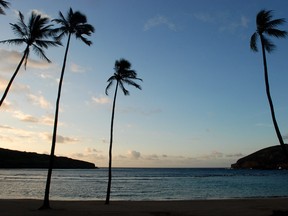 The sun rises over Oahu's Hanauma Bay near Honolulu on May 11, 2016. (AP Photo/Caleb Jones)