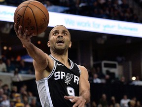 In this Jan. 24, 2018, file photo, San Antonio Spurs guard Tony Parker shoots during the second half of an NBA basketball game, in Memphis, Tenn.