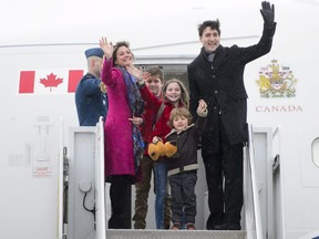 Prime Minister Justin Trudeau, right, departs Ottawa with his wife Sophie Gregoire Trudeau and their children on Feb. 16, 2018, en route to India.