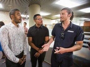 TTC heroes Kyle Busquine (from left), Jehangir Faisal and Julio Cabrera after talking with media at City Hall in Toronto, Ont. on Tuesday July 10, 2018. They were recognized during a TTC Board meeting for their heroic efforts, saving a visually impaired man who had fallen on the subway tracks on June 28th at Broadview Station. (Ernest Doroszuk/Toronto Sun)