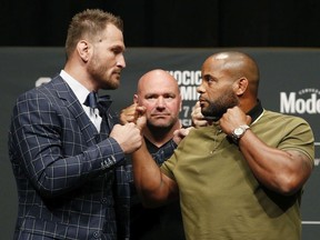 Stipe Miocic, left, and Daniel Cormier pose during a news conference for UFC 226, Thursday, July 5, 2018, in Las Vegas. The two are scheduled to fight in a heavyweight title fight Saturday in Las Vegas.