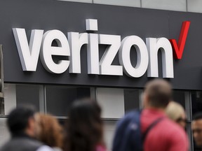 In this Tuesday, May 2, 2017, file photo, Verizon corporate signage is captured on a store in Manhattan's Midtown area, in New York. (AP Photo/Bebeto Matthews, File)