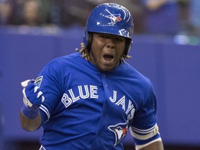 Blue Jays' Vladimir Guerrero Jr. celebrates his walk-off home run to defeat the Cardinals during spring training action March 27, 2018 in Montreal.