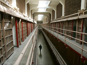 A National Park Service ranger walks down "Broadway" in the main cell block on Alcatraz Island, 14 June 2007 in San Francisco Bay of California.(Robyn Beck/Getty Images)