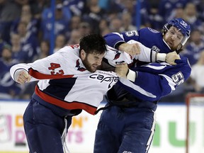 Tampa Bay Lightning defenceman Braydon Coburn, right, and Washington Capitals right wing Tom Wilson fight Wednesday, May 23, 2018, in Tampa, Fla. (AP Photo/Chris O'Meara)