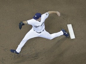 Milwaukee Brewers starting pitcher Brent Suter throws during the first inning of a baseball game against the Los Angeles Dodgers Sunday, July 22, 2018, in Milwaukee.