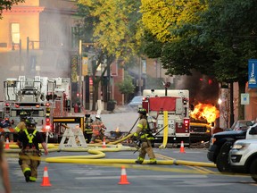 Firefighters work the scene of an explosion in downtown Sun Prairie, Wis., Tuesday, July 10, 2018.