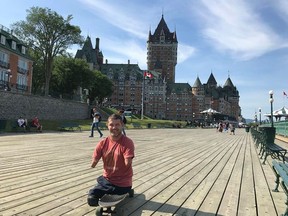 Chris Koch in Quebec City on July 19, with the Château Frontenac in the background. Koch, born without limbs, clocked more than 6,300 km in 18 days in July from southern Alberta to St.John's, Nfld., with is skateboard and a small pack.
