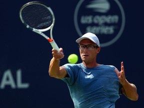 Peter Polansky of Canada plays a shot against Matthew Ebden of Australia during a 1st round match on Day 1 of the Rogers Cup at Aviva Centre on August 6, 2018 in Toronto.  (Vaughn Ridley/Getty Images)