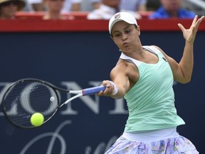 Ashleigh Barty of Australia hist a return against Kiki Bertens of the Netherlands during day five of the Rogers Cup at IGA Stadium on August 10, 2018 in Montreal, Quebec, Canada.