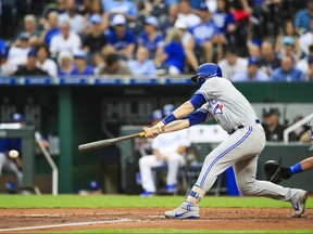 Danny Jansen of the Toronto Blue Jays hits the ball during during his Major League debut in the second inning against the Kansas City Royals at Kauffman Stadium on August 13, 2018 in Kansas City, Missouri. (Brian Davidson/Getty Images)