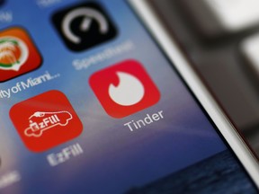In this photo illustration, the icon for the dating app Tinder is seen on the screen of an iPhone on August 14, 2018 in Miami, Florida.