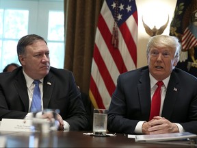 U.S. President Donald Trump (R), speaks during a Cabinet Meeting in the Cabinet Room of the White House on August 16, 2018 in Washington, DC.